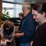 Kristine is enjoying autographing her books.